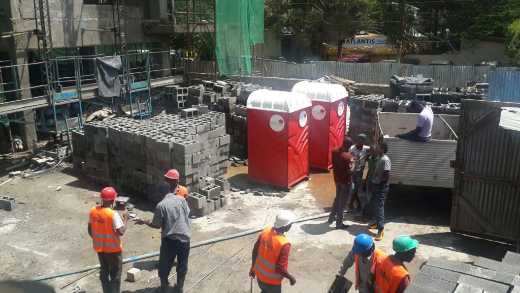 Karibu loo's portable toilets serving Workers working at a construction site. 
